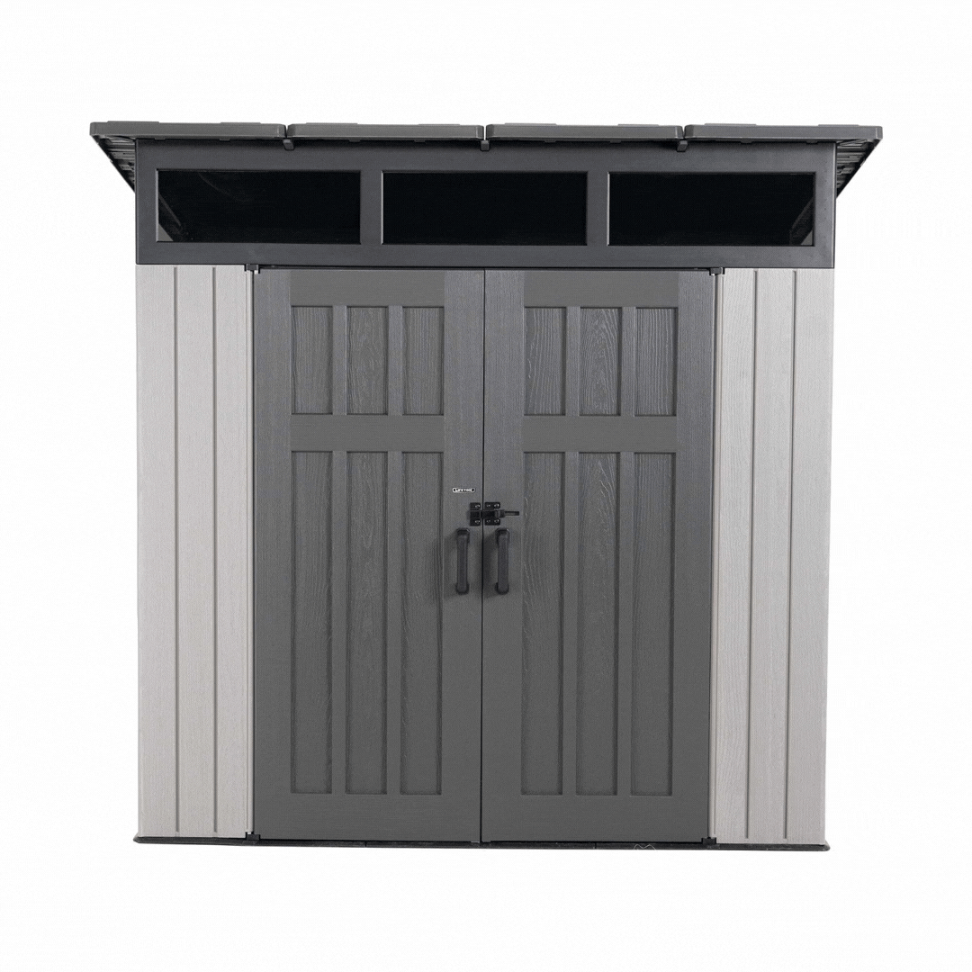 360 view of the Lifetime Farmhouse Storage Shed 60542 showing wide wood-grain double doors, black hasp latch, three skylight windows, and light gray panels